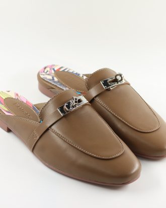 Women’s tan slip-on loafers with silver buckle and colorful printed insole